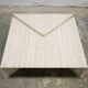 Series of 2 vintage travertine coffee tables published by Roche Bobois