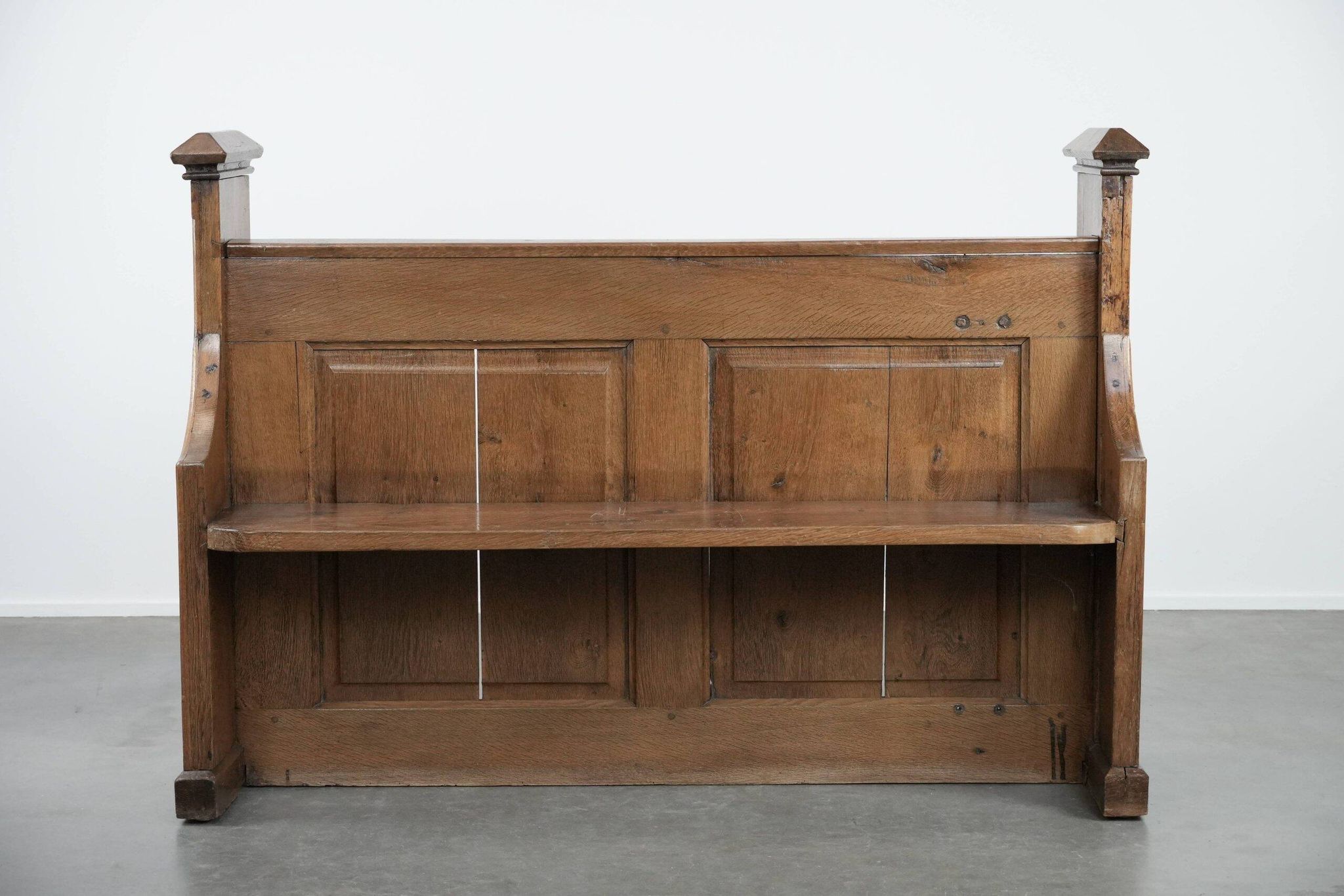 Antique oak church bench in Gothic style with beautiful wood carving
