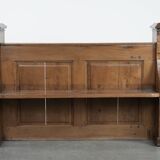 Antique oak church bench in Gothic style with beautiful wood carving