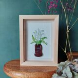 Composition d'un bouquet des muguets dans un pot en argile en forme the chaussure