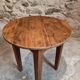 Antique round side table with oak legs and a pine top, circa 1900.