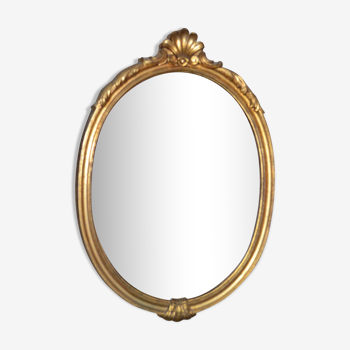 Oval golden mirror