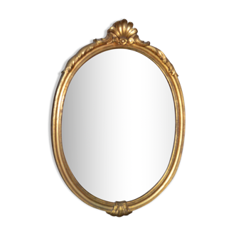 Oval golden mirror