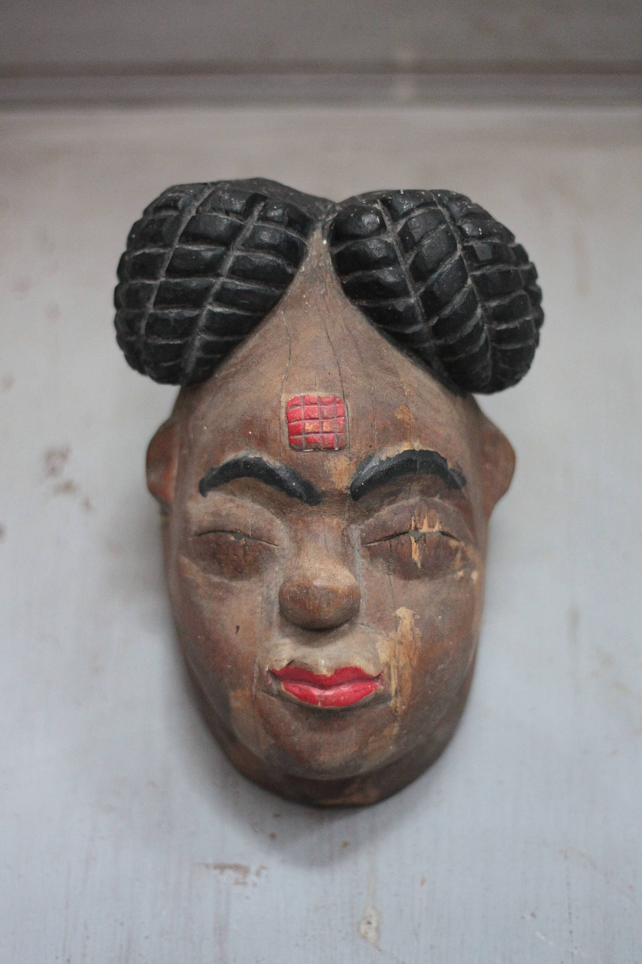 Ancient Okuyi mask, Punu mask from Gabon, carved wood, collection, ethnic art.
