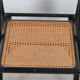 Folding chair seated in cannage