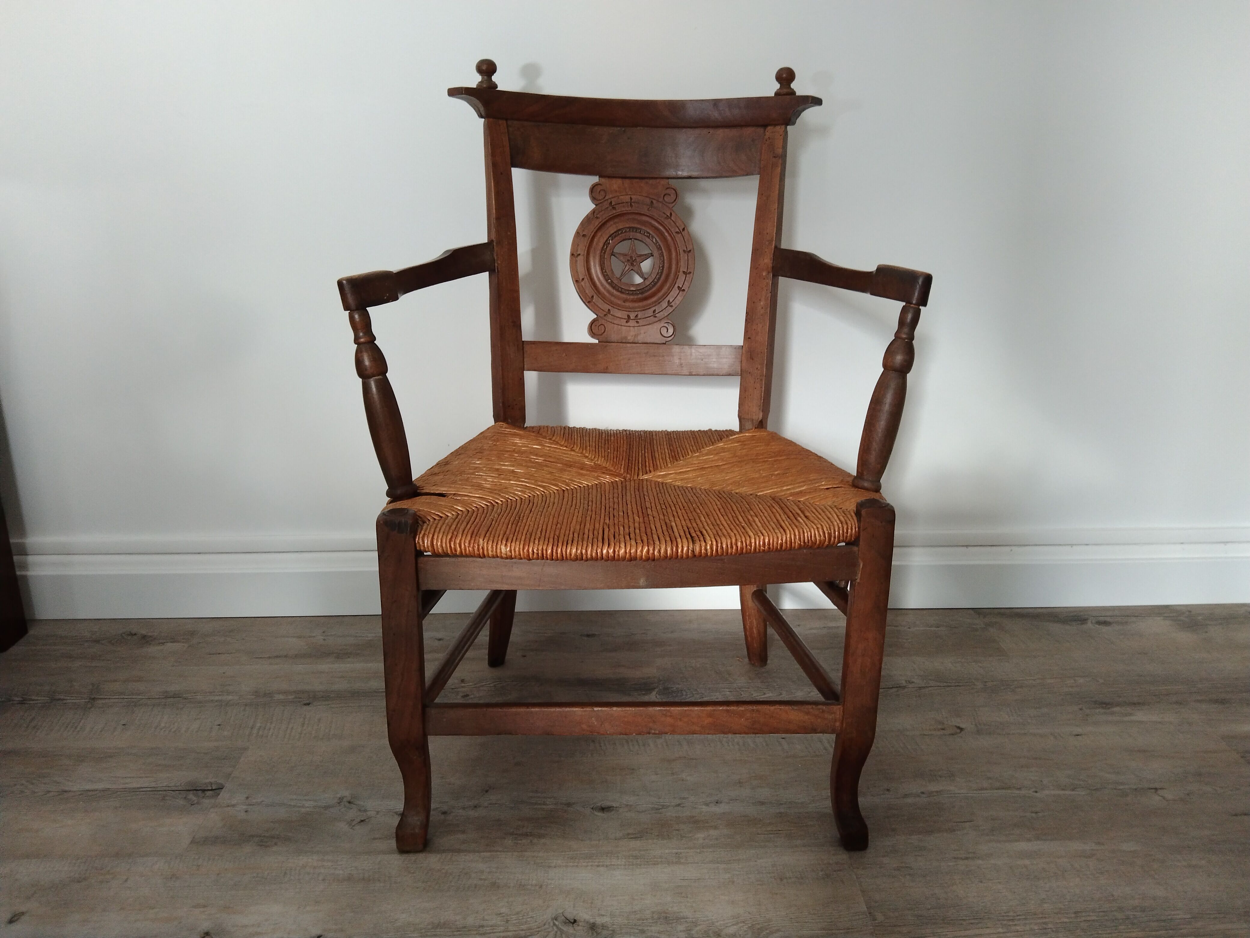 Straw armchair folk art.