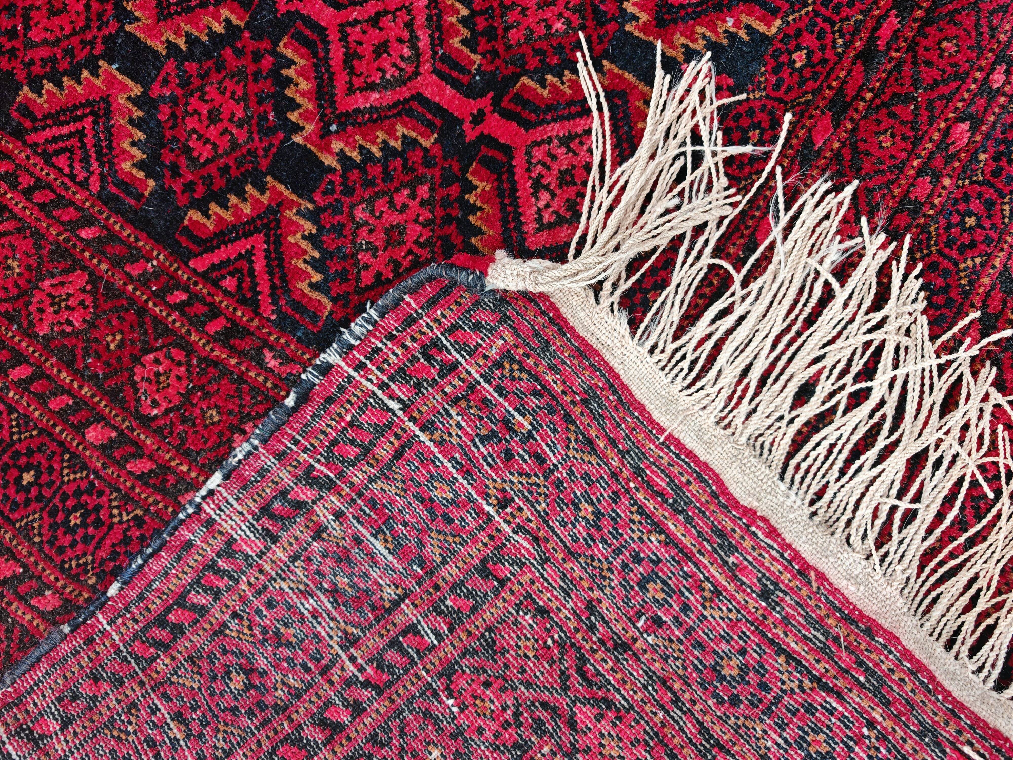 Vintage Baluch carpet handmade from natural wool, Afghanistan 1960.