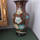 Large vintage antique vase with raised floral pattern.