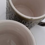 Duo of BP 70's slip mugs