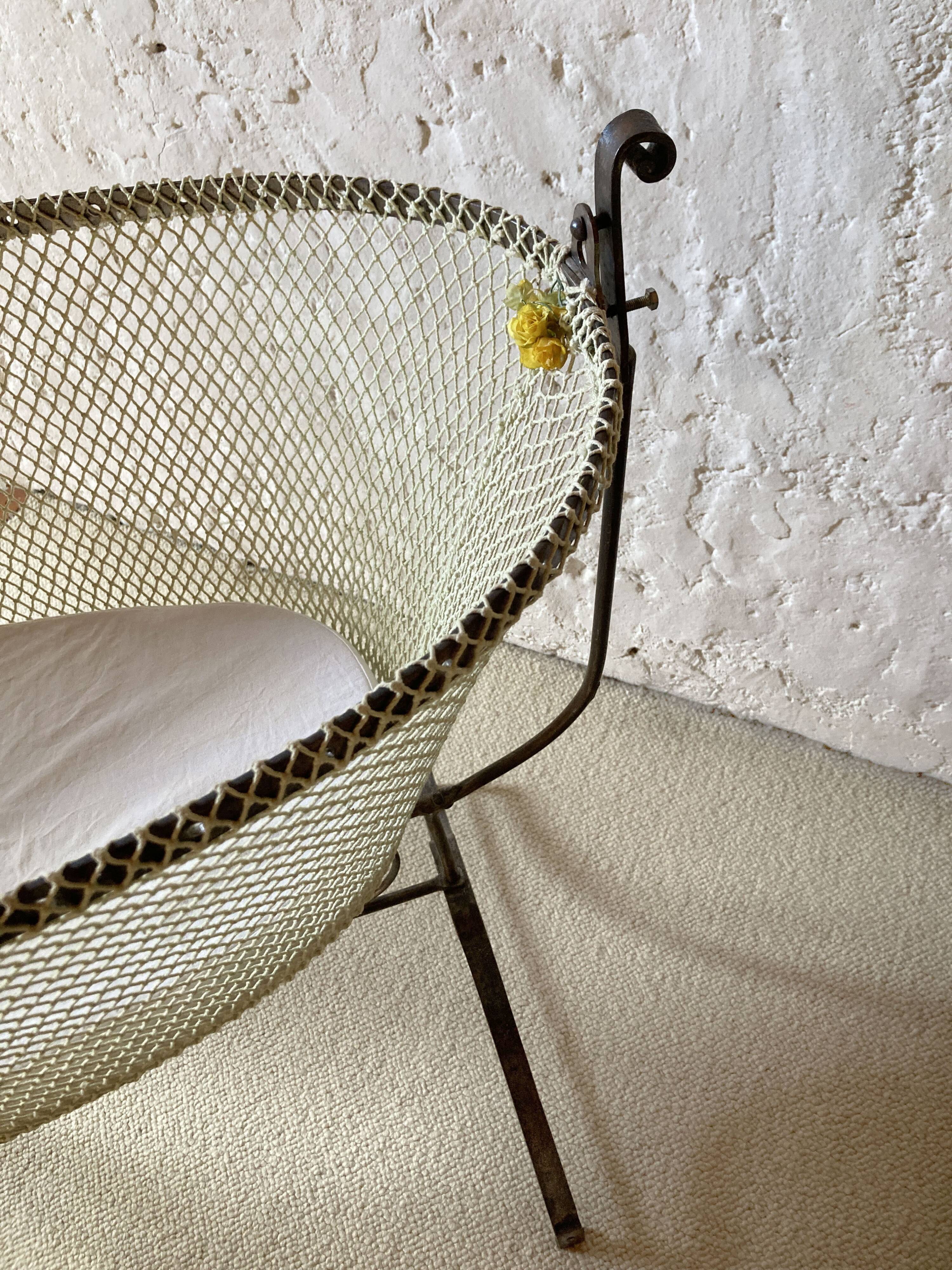 Antique rocking cradle in wrought iron