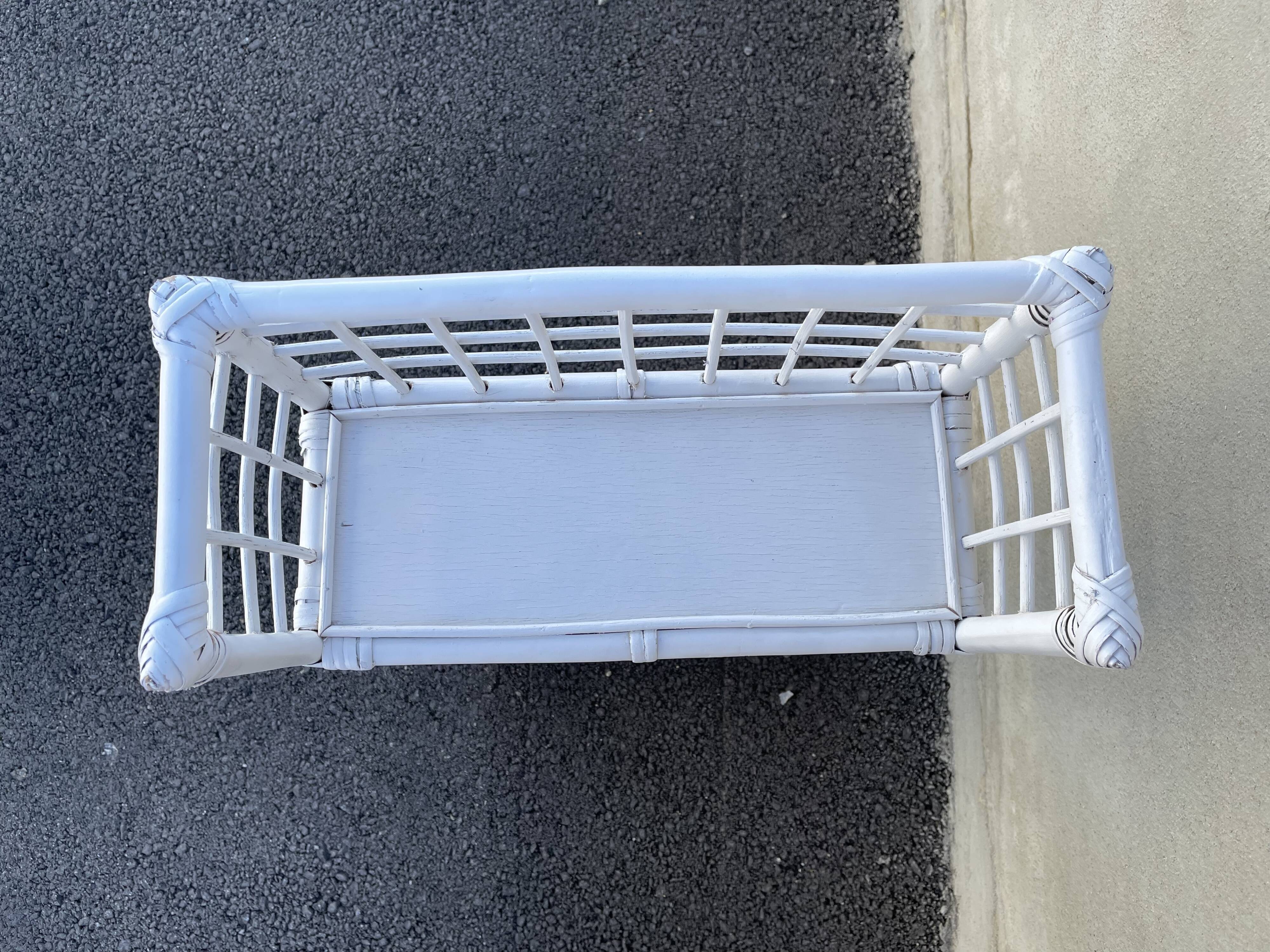 White rattan shelf with braces