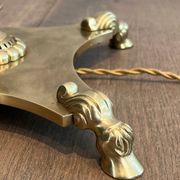 Neoclassical brass floor lamp with claw feet from Maison Jansen.