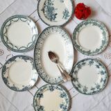 Old flat plates mismatched in iron earth accompanied by a serving dish