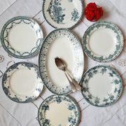 Old flat plates mismatched in iron earth accompanied by a serving dish