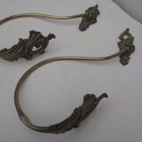 Pair of embraces in numerotée solid brass, rocaille style