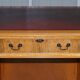 Vintage satin wood partner desk with leather top.