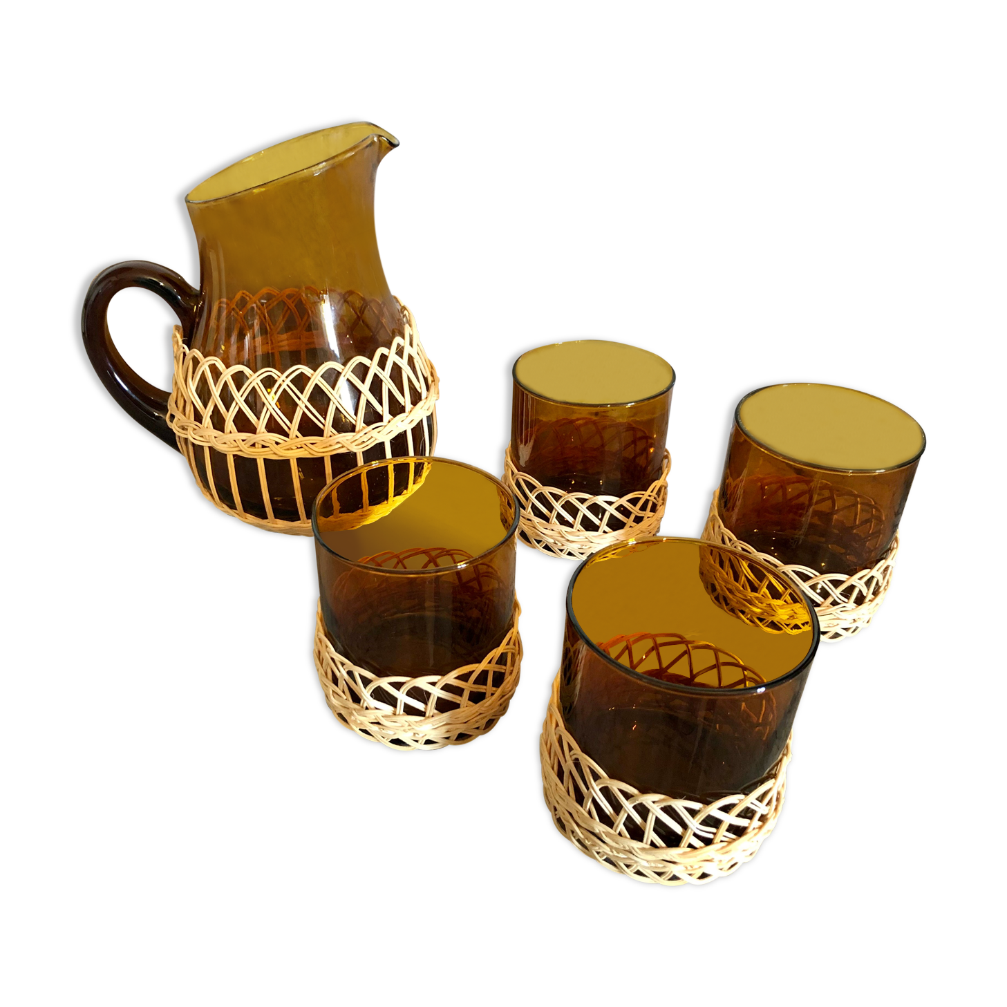 Pitcher and amber glasses and rattan