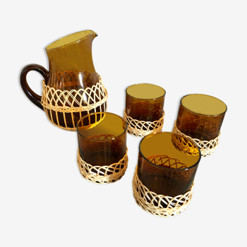 Pitcher and amber glasses and rattan