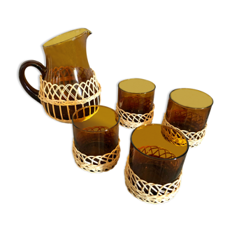 Pitcher and amber glasses and rattan