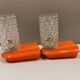 Bathroom lamps in a nice orange colour with a crystal glass shade and a base of hard thin plastic