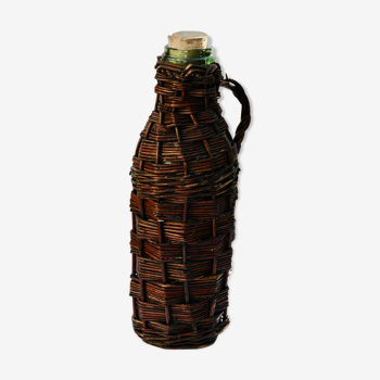 Ancient bottle in wicker