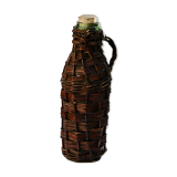 Ancient bottle in wicker