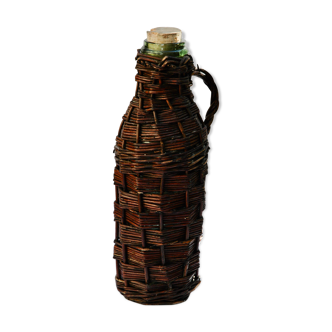 Ancient bottle in wicker
