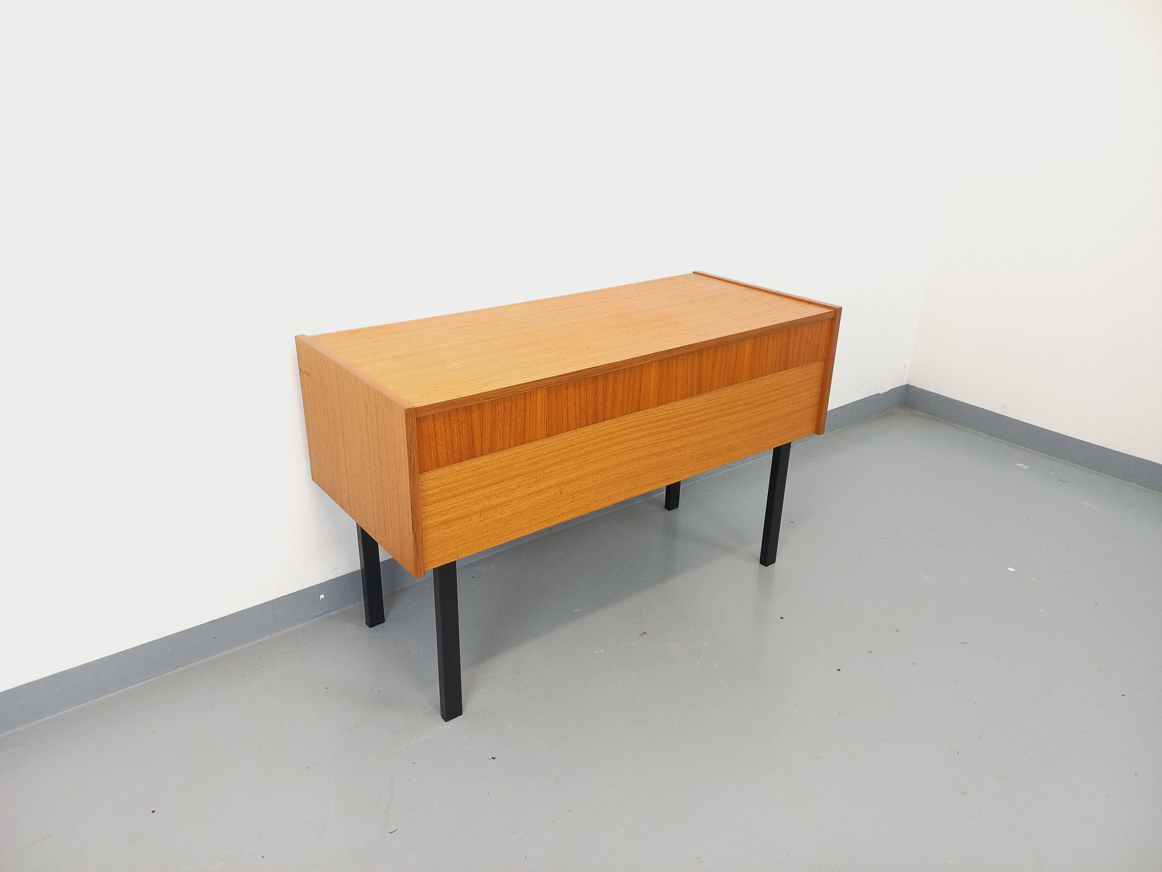 Vintage teak and black metal storage unit / chest on legs from the 70s