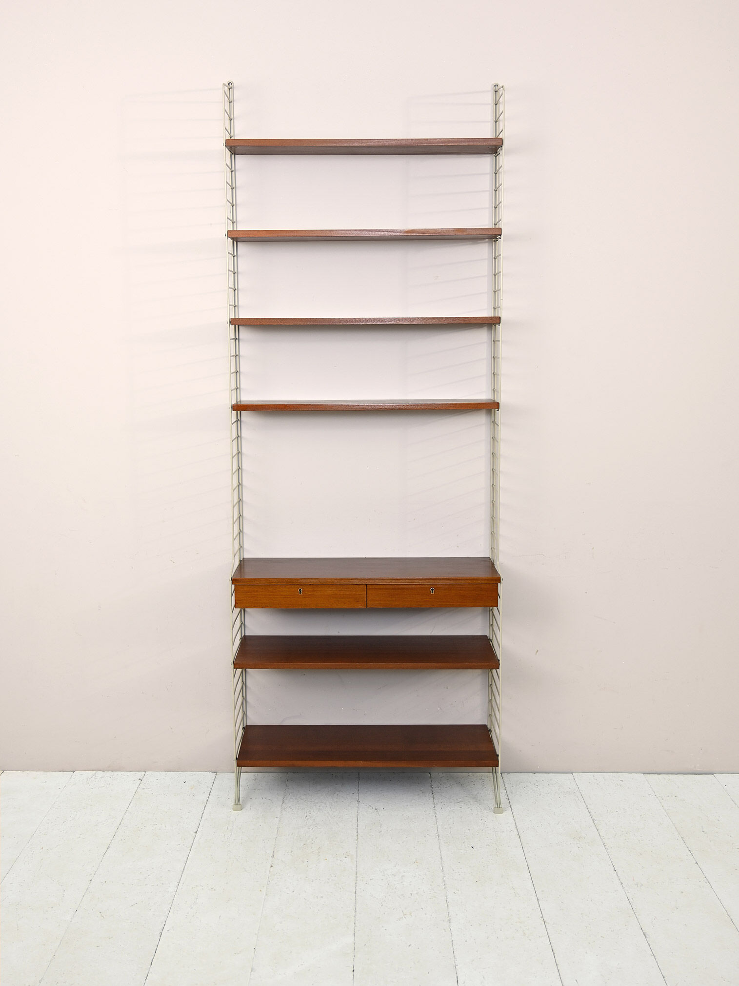 'string' bookcase with metal frame