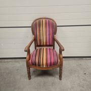 Antique striped multicoloured velvet armchair with turned legs.