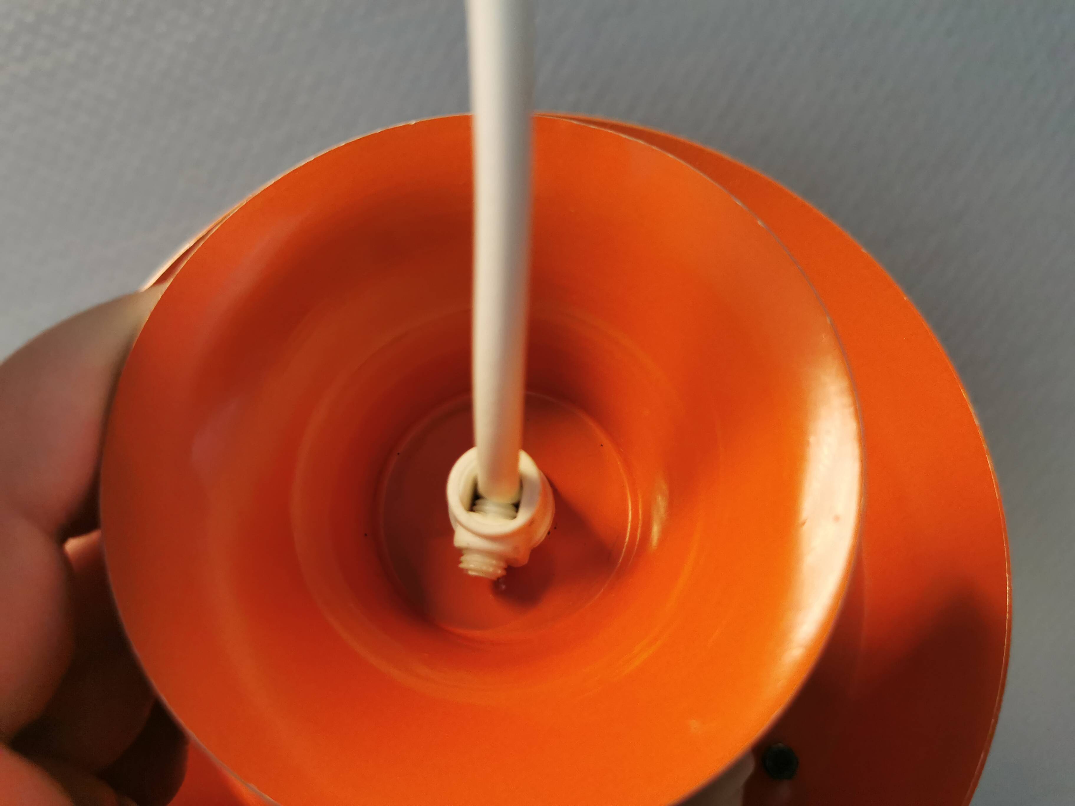 Danish/Swedish hanging lamp, in silver-coloured aluminium with orange interior paint.