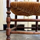 Low Provencal chair in dark wood and woven straw