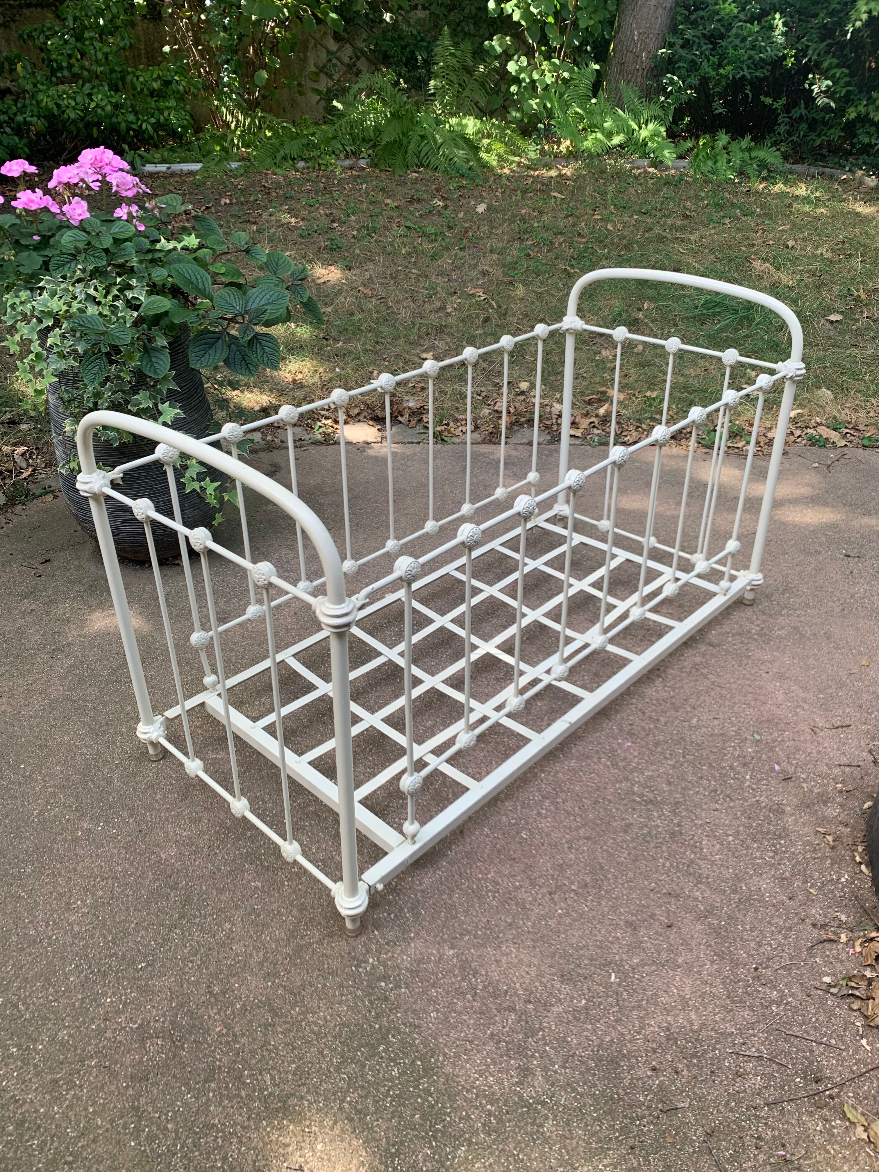 Wrought iron sofa bed with box spring.