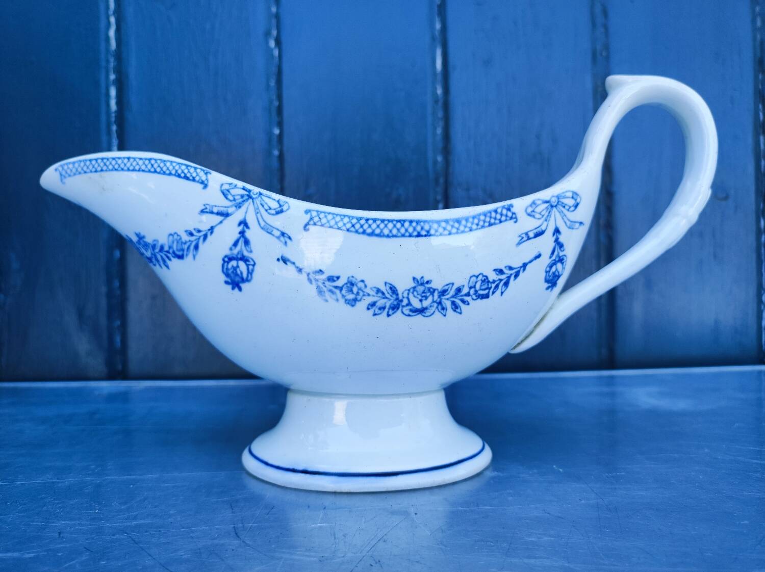 Old earthenware sauce boat