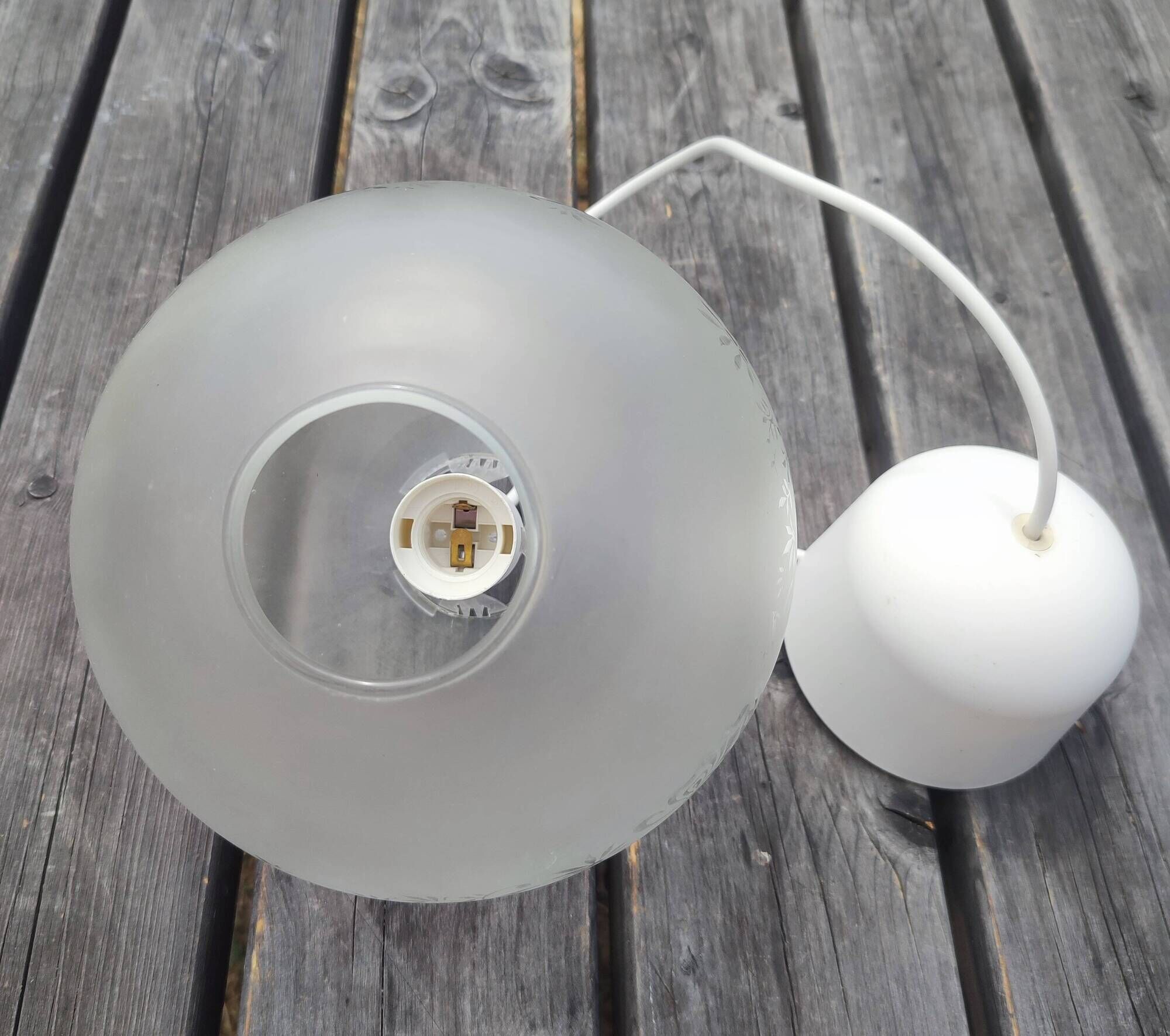 Frosted glass suspension globe with floral patterns in Art Deco style.