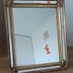 Miroir à pareclose doré