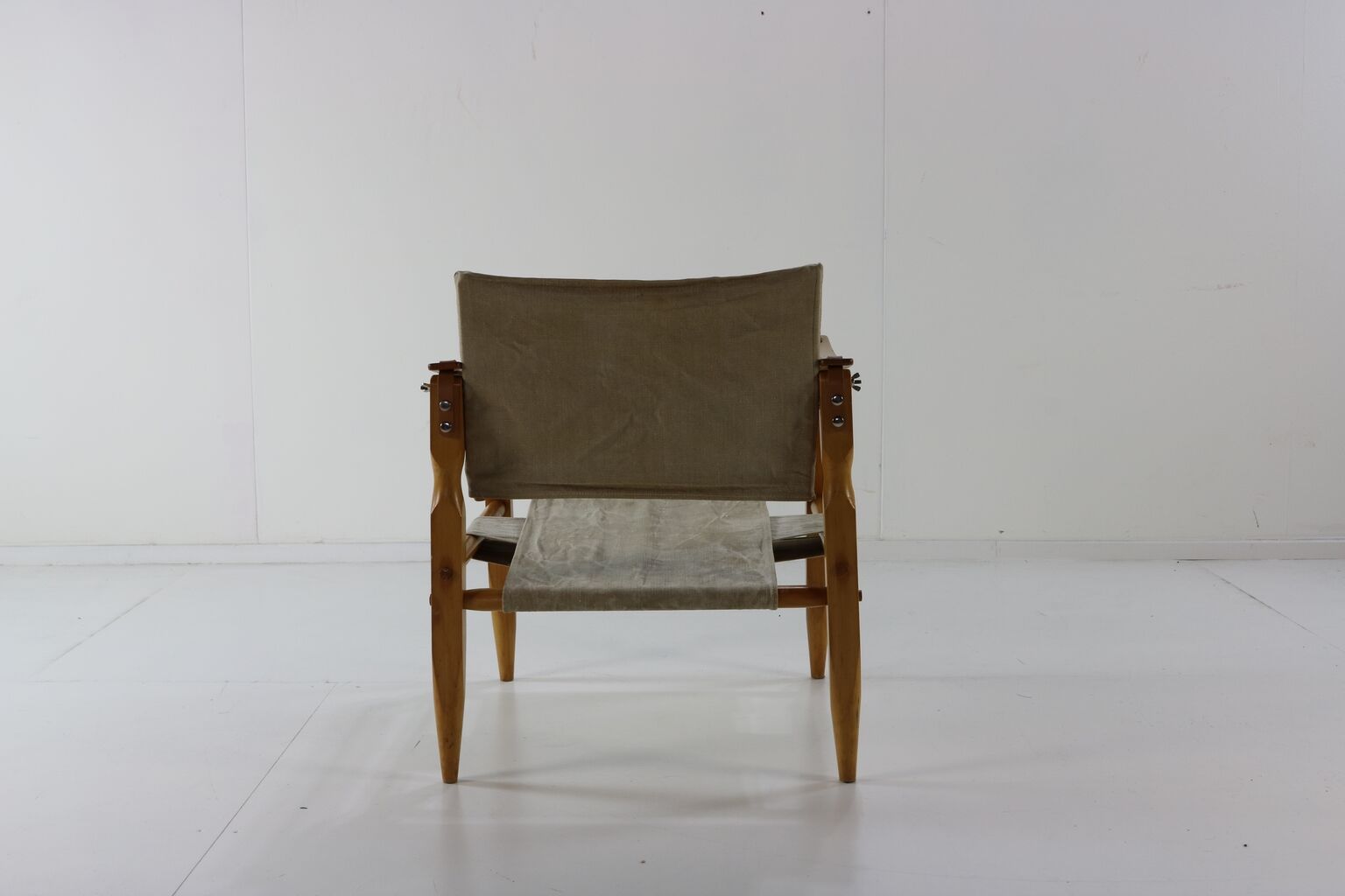 Danish design safari chair with wooden armrests