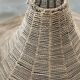 Large lampshade made of woven ropes.