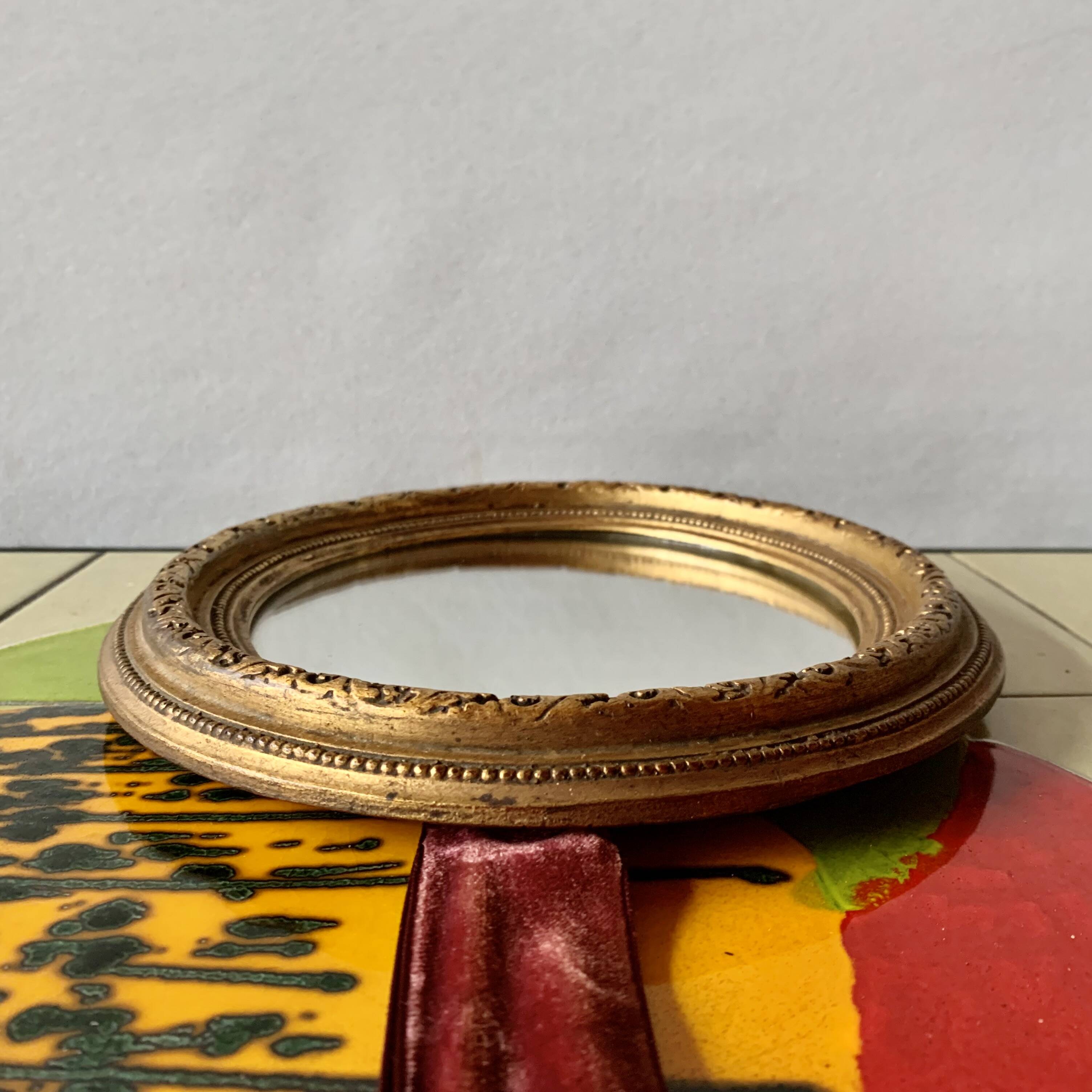 Small vintage wall mirror in gold painted wood