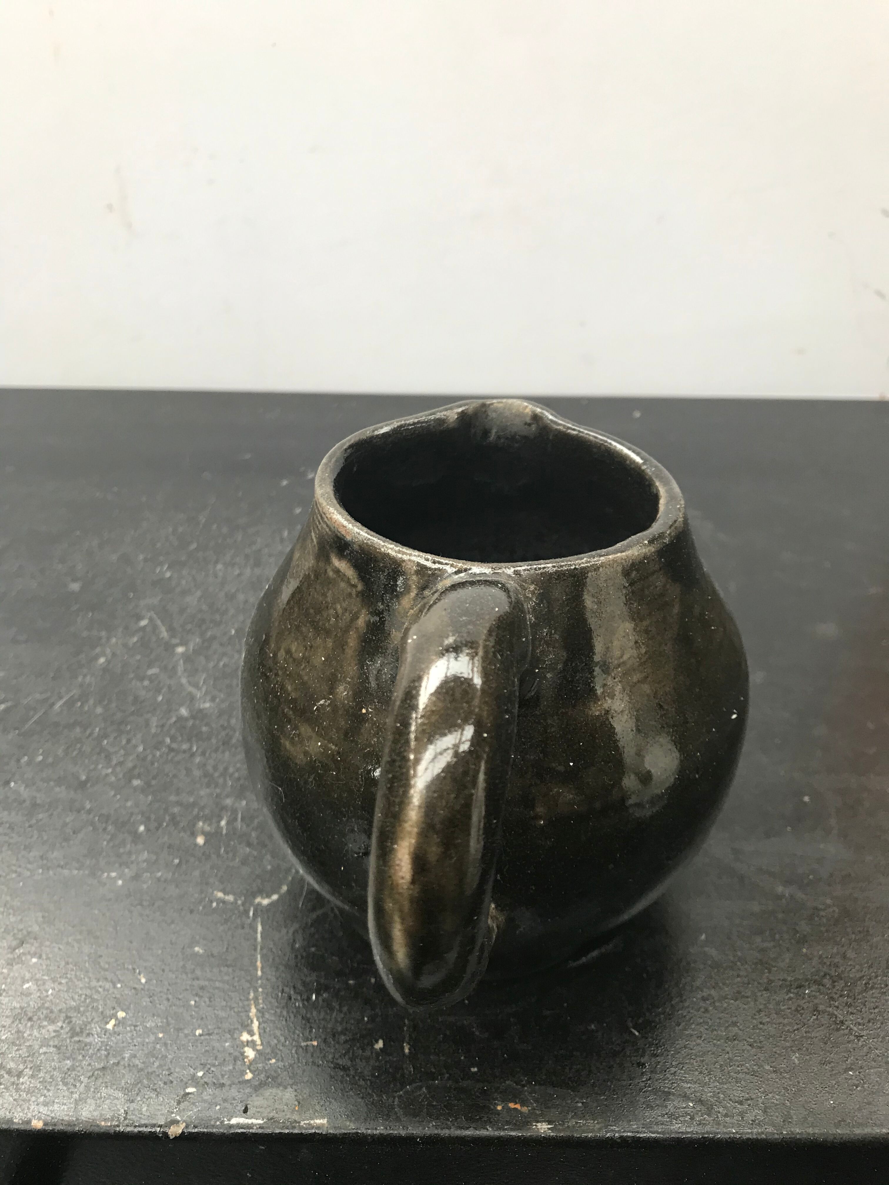 Former black ceramics pitcher 70
