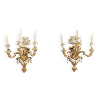 Pair of Louis XVI style wall lights in gilded and lacquered wood. Circa 1900.