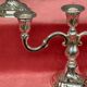 Pair of candlesticks. Silver-plated metal.