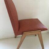 Red vintage chairs and compass feet