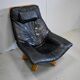 Leather and beech relaxation chair - 1970 / 1980