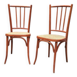 Pair of wooden and cane bistro chairs