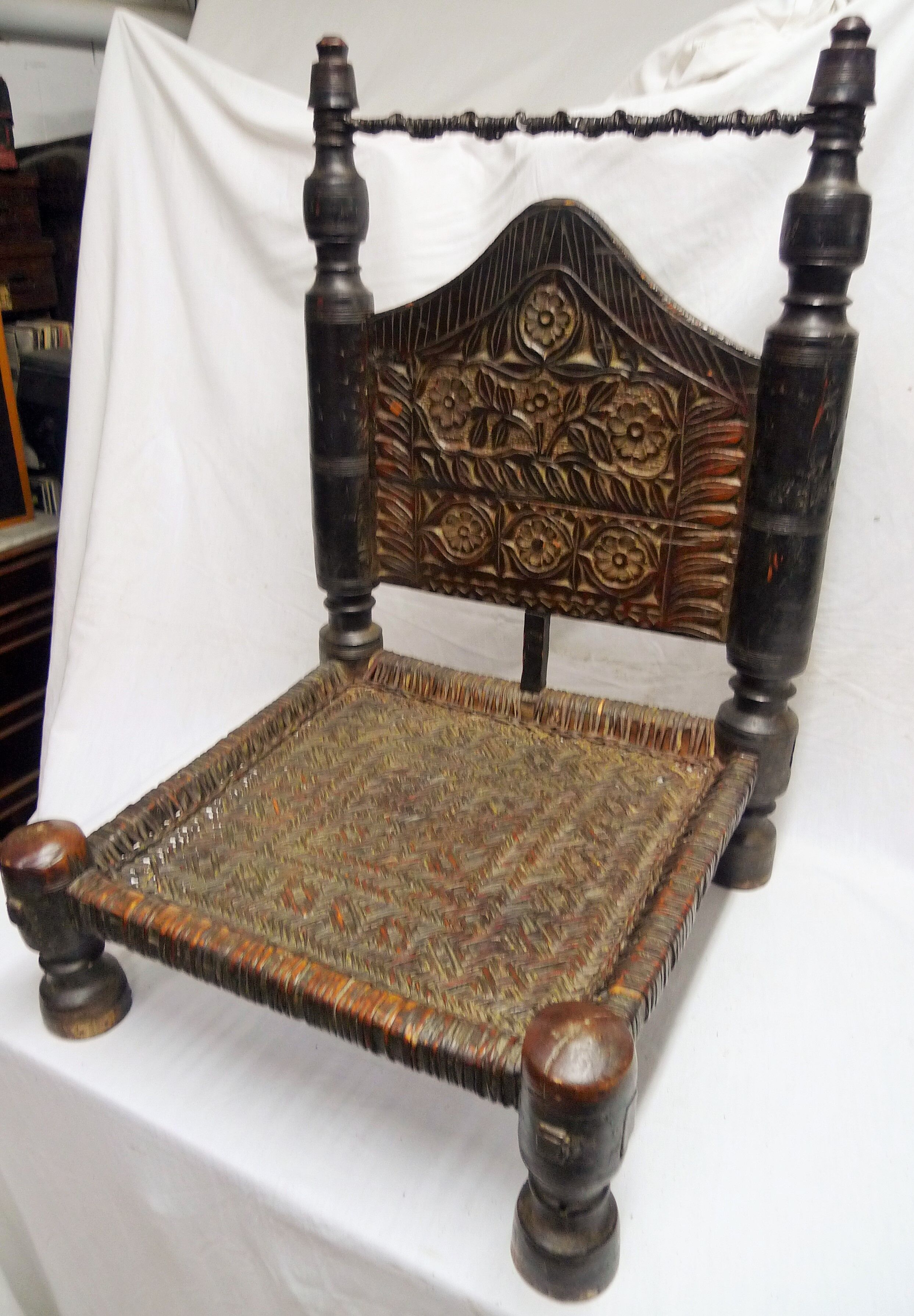 Traditional low chair in wood and leather
