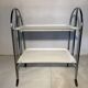 Vintage folding dessert table in chrome metal with enamelled trays.