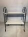 Vintage folding dessert table in chrome metal with enamelled trays.