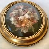 Golden oval frame dried flowers