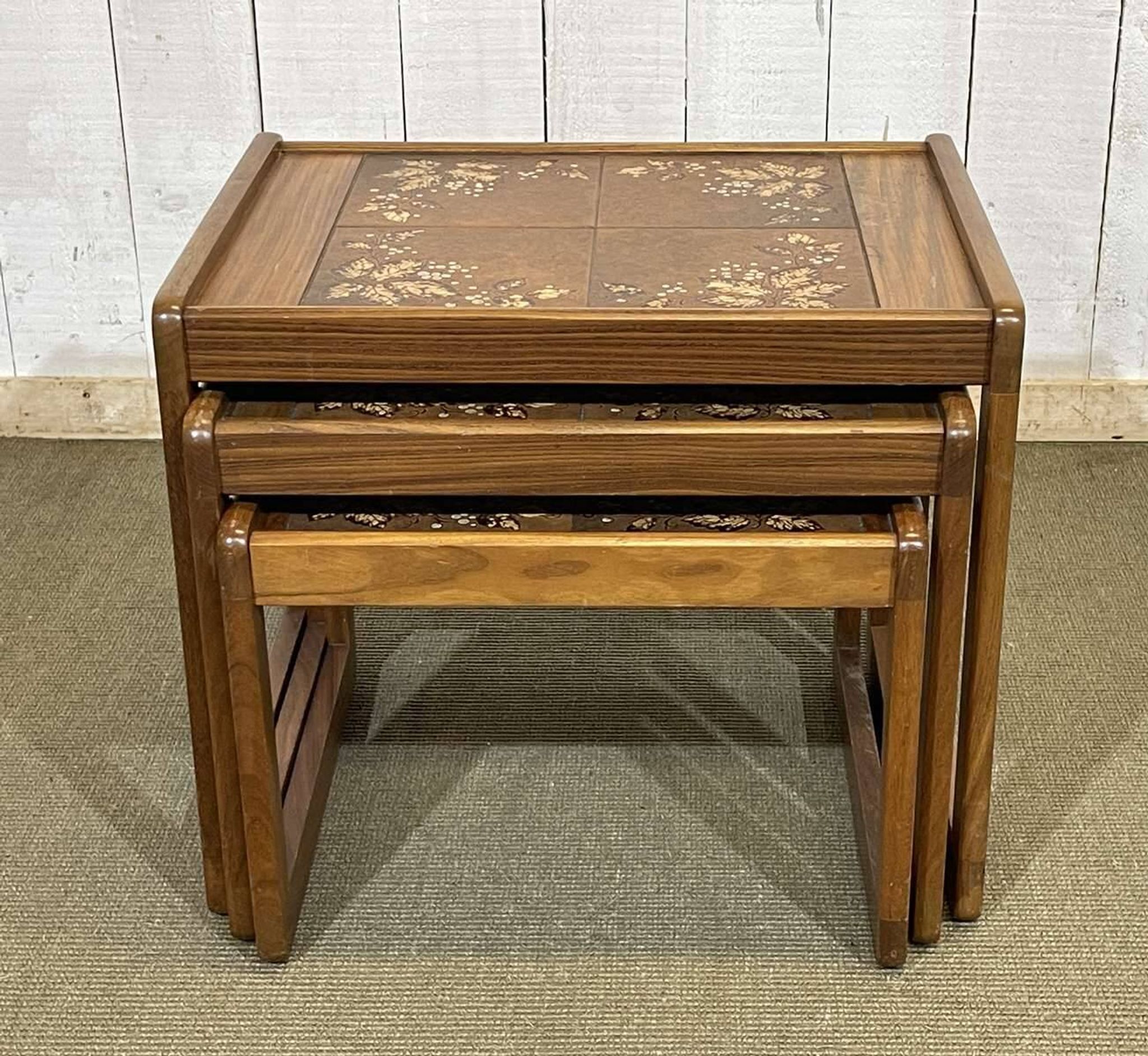 Set of 3 nesting tables in teak with tiled tops.